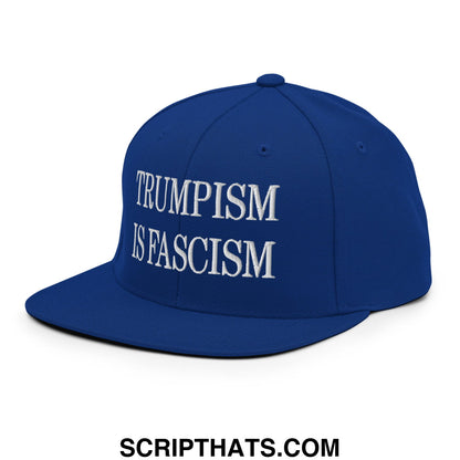 Royal blue snapback hat with white embroidered text trumpism is fascism and a flat bill brim design