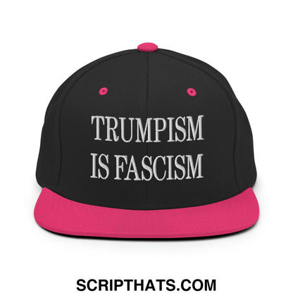 Black snapback cap with vibrant pink brim and button embroidered with trumpism is fascism in white text