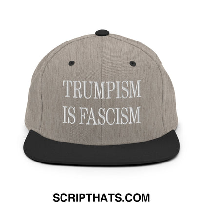 Gray and black snapback hat with white embroidered trumpism is fascism text and flat bill brim design