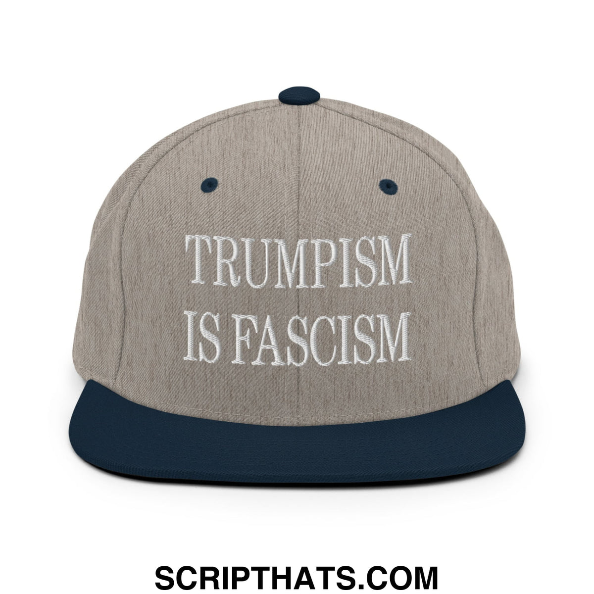 A gray and navy blue snapback hat with white embroidered text reading trumpism is fascism on the front panel
