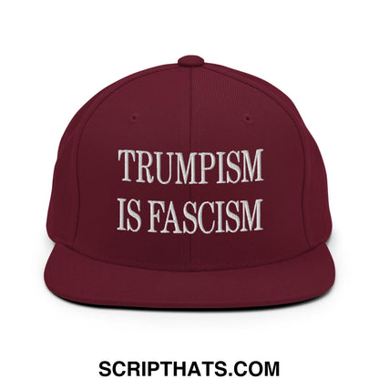 Maroon snapback hat with white embroidered trumpism is fascism text on flat bill brim for casual wear