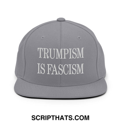 Gray snapback cap with white embroidered text reading trumpism is fascism flat bill brim design
