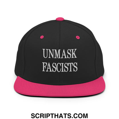 Black snapback cap with vibrant pink brim and button featuring white embroidered unmask fascists text