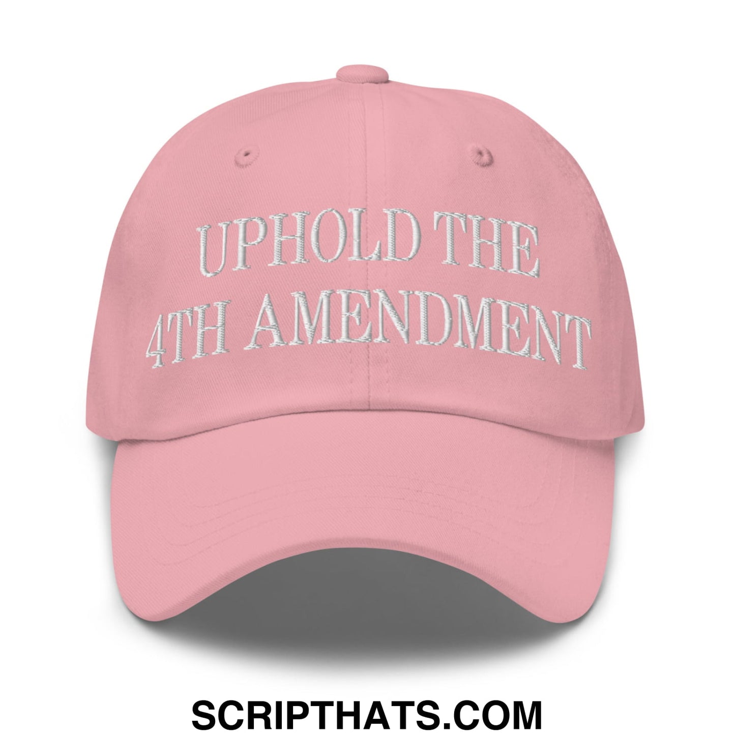 A soft pink unstructured dad hat with uphold the 4th amendment embroidered in white thread on the front