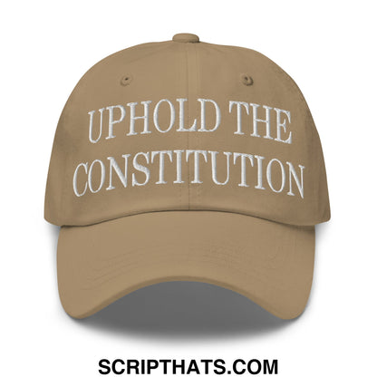 Tan unstructured dad hat with white embroidered text uphold the constitution on the front panel