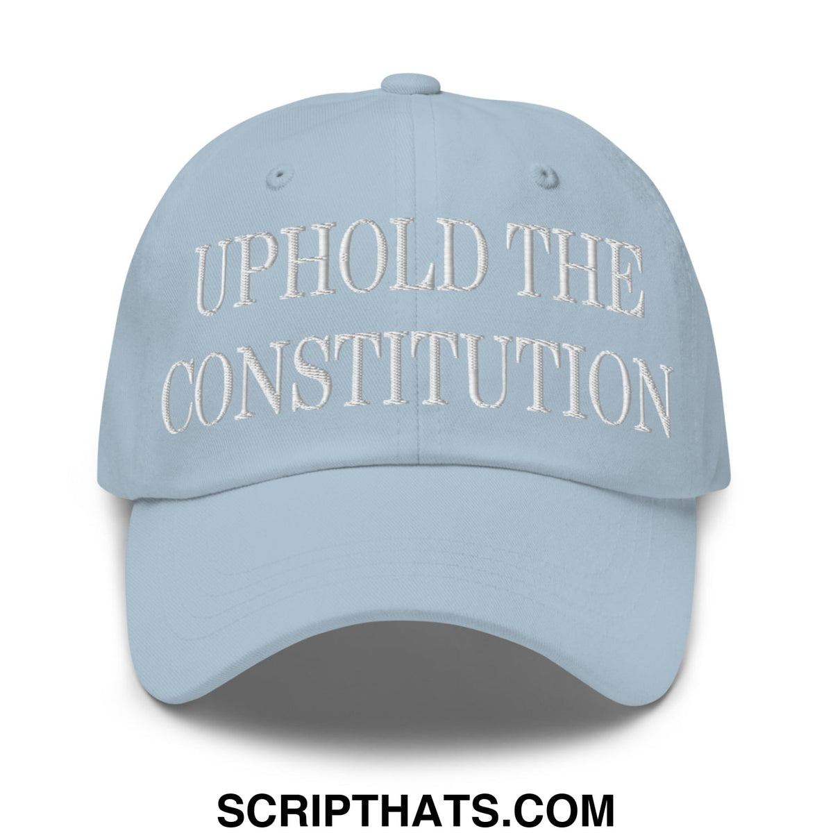 Light blue unstructured dad hat with white embroidered text uphold the constitution on front panel