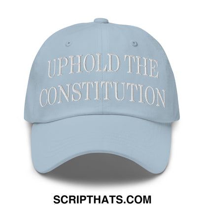Light blue unstructured dad hat with white embroidered text uphold the constitution on front panel