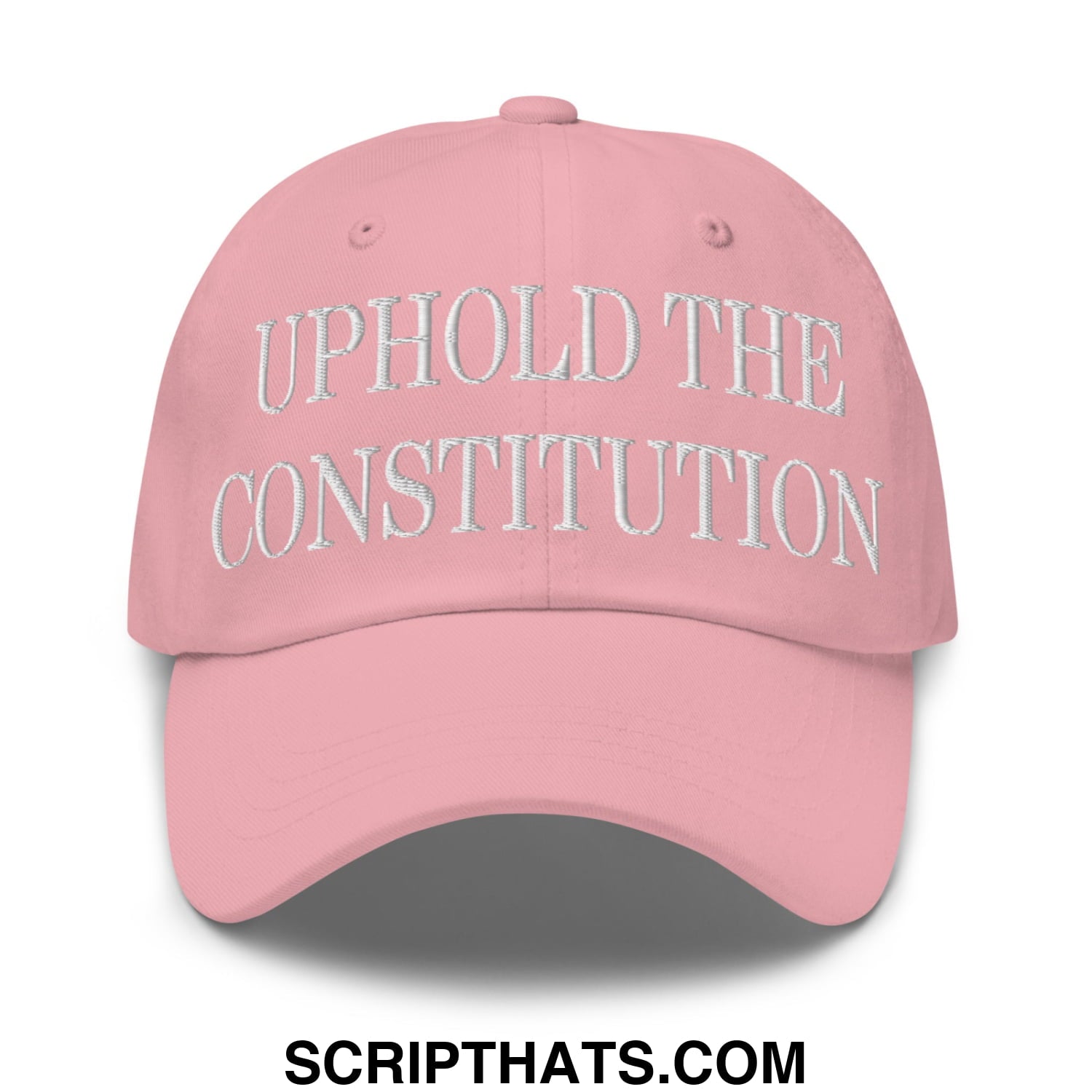 A soft pink unstructured dad hat with uphold the constitution embroidered in white thread on the front