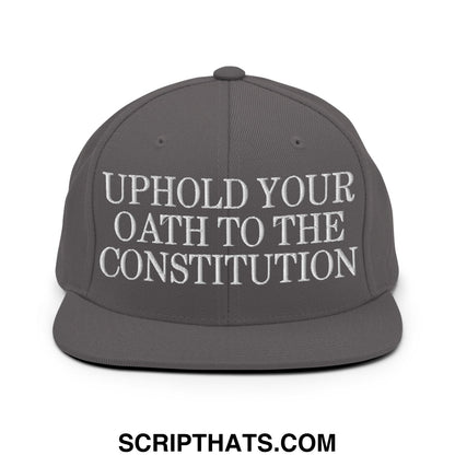 Dark gray snapback cap with white embroidered uphold your oath to the constitution text and flat bill brim