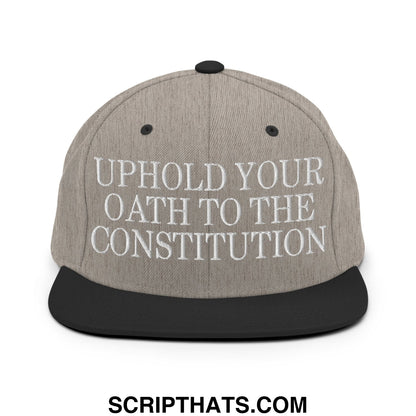 Gray snapback hat with black brim and embroidered white text uphold your oath to the constitution on front