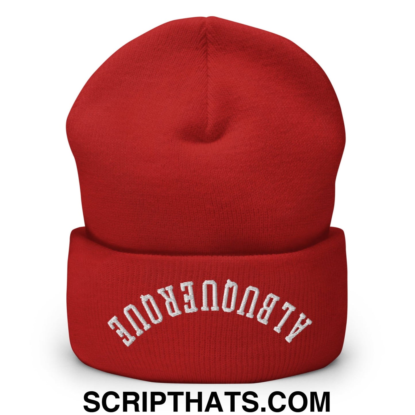 A vibrant red knit beanie with a folded cuff embroidered with albuquerque in white arched lettering