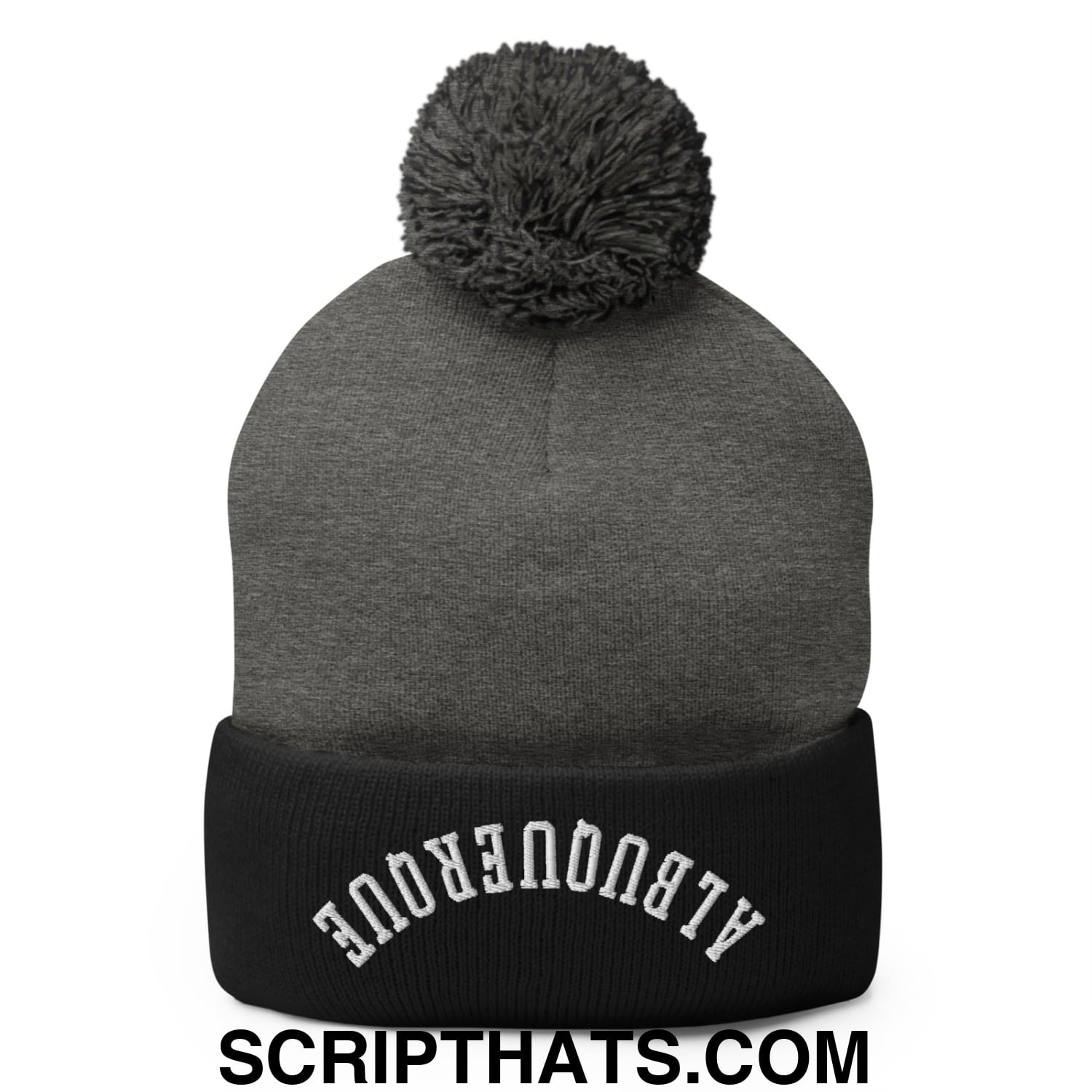 Gray knit beanie with black ribbed cuff embroidered with upside down albuquerque text and gray pom pom on top