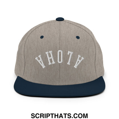 A gray and navy blue snapback hat with white embroidered upside down aloha lettering and a flat bill brim