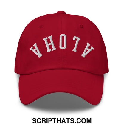 Red unstructured dad hat with white embroidered ahot a lettering in arched design upside down aloha style