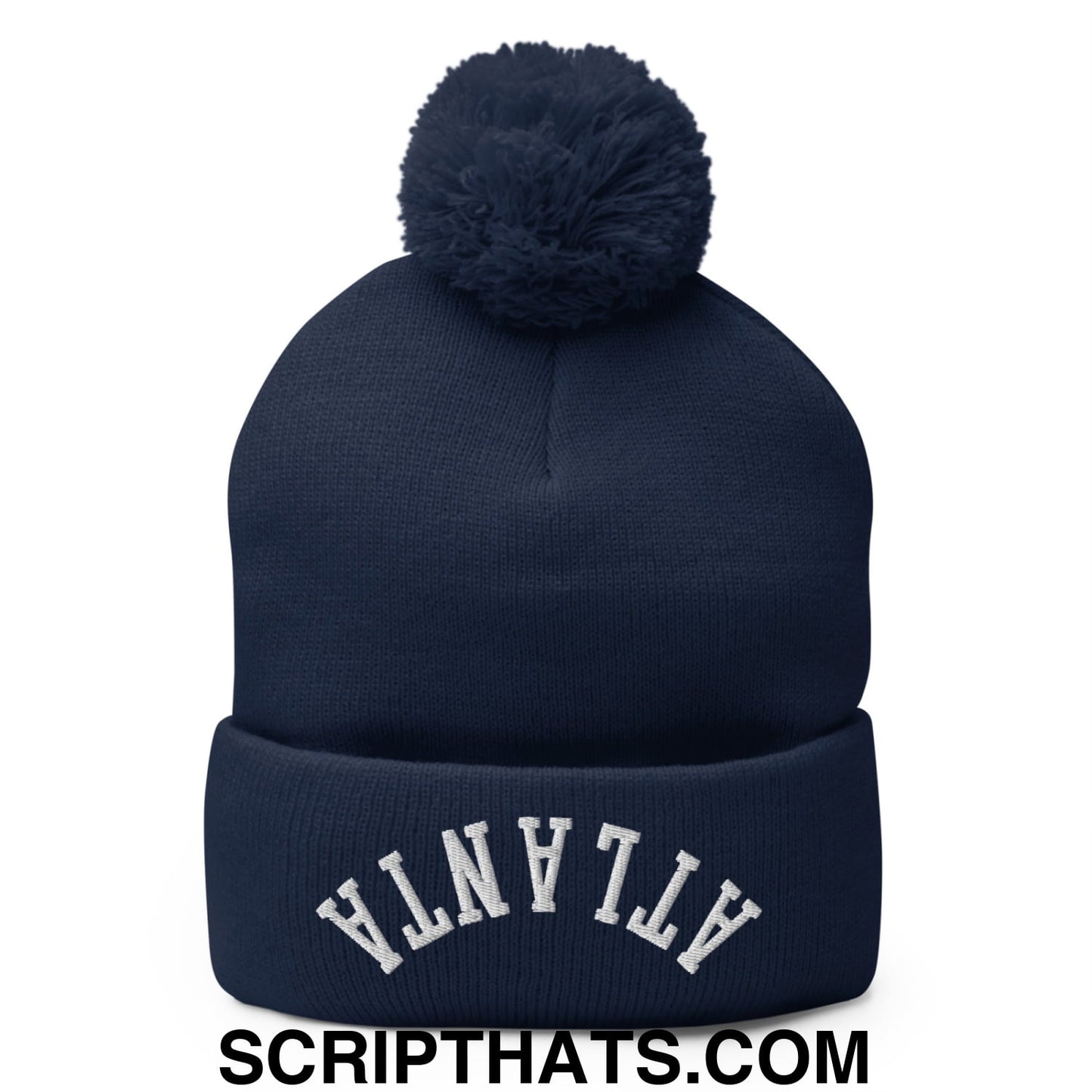 Navy blue knit beanie with matching pom pom and white embroidered atlanta lettering on the cuff