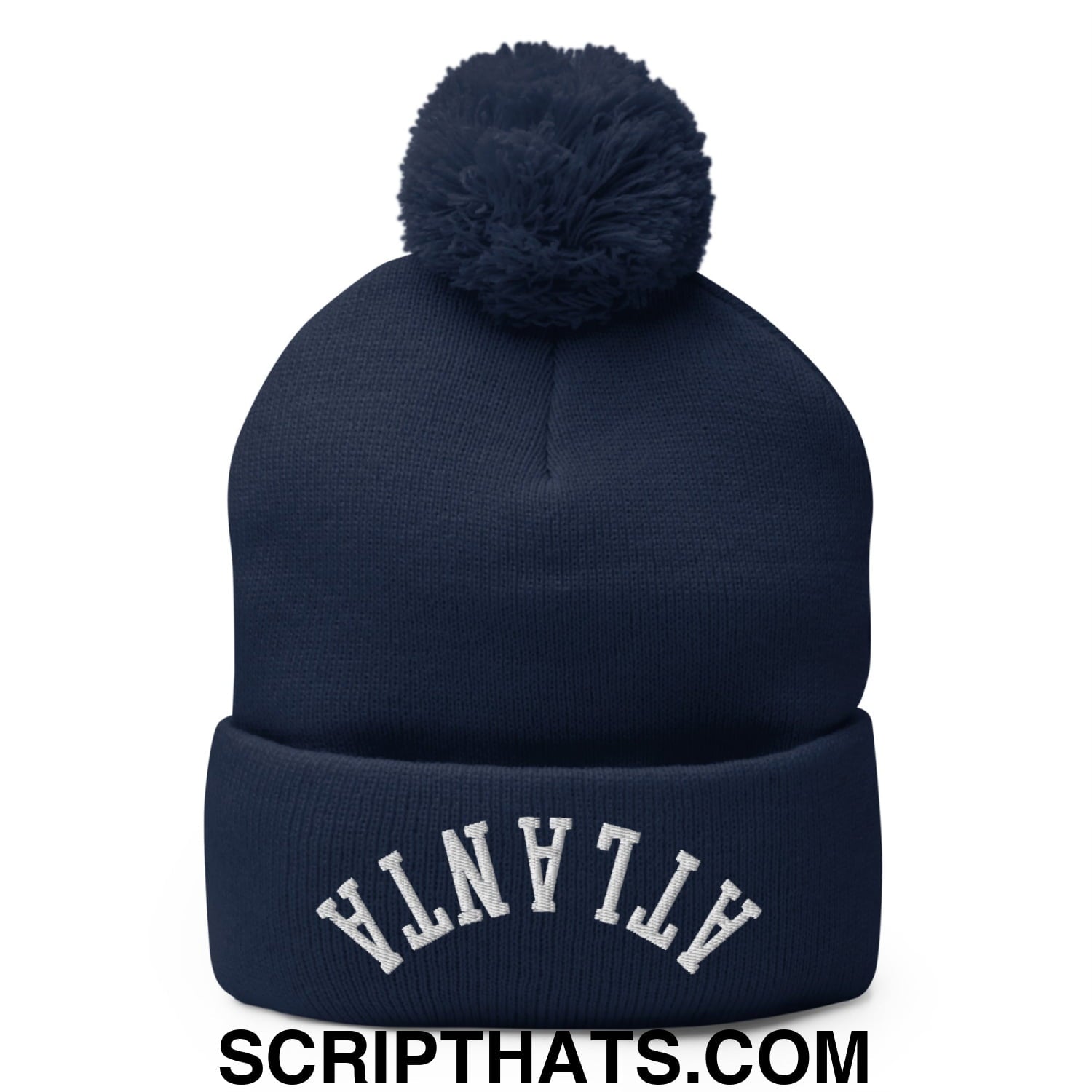 Navy blue knit beanie with matching pom pom and white embroidered atlanta lettering on the cuff