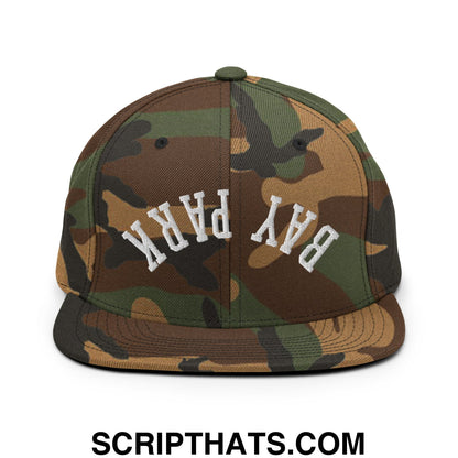 Camouflage snapback hat with bay park embroidered in white arched lettering and a flat bill brim