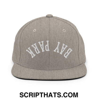 Gray heather snapback cap with white embroidered bay park lettering and flat bill brim in an upside down design