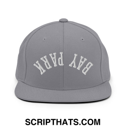 Gray snapback hat with white embroidered bay park lettering and flat bill brim in upside down style