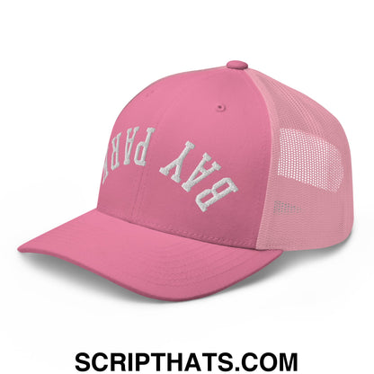 Pink mesh trucker hat with white embroidered bay park lettering across the front in upside down style