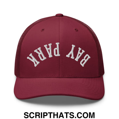 Maroon mesh trucker hat with white embroidered bay park arch on front upside down design