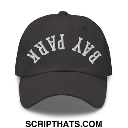 Black unstructured dad hat with white embroidered bay park lettering in an arched design on the front panel