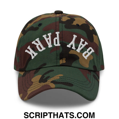 A camouflage unstructured dad hat with bay park embroidered in white arched lettering on the front