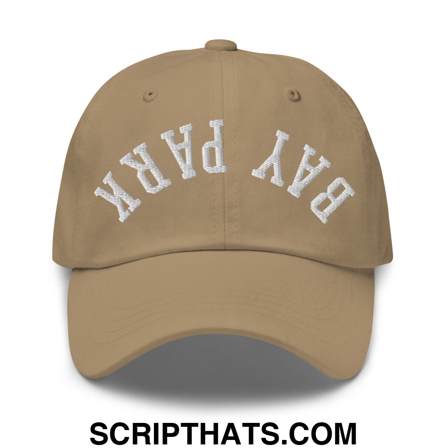 Tan unstructured dad hat with white embroidered bay park lettering in an arched design, upside down style