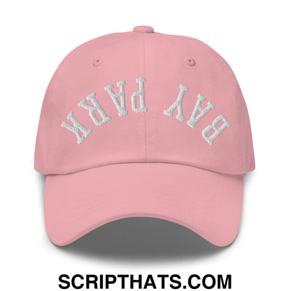 A soft pink unstructured dad hat with bay park embroidered in white thread across the front