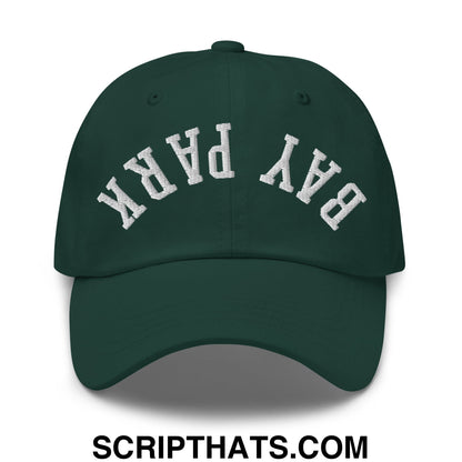 Dark green unstructured dad hat with white embroidered bay park lettering in an arched design