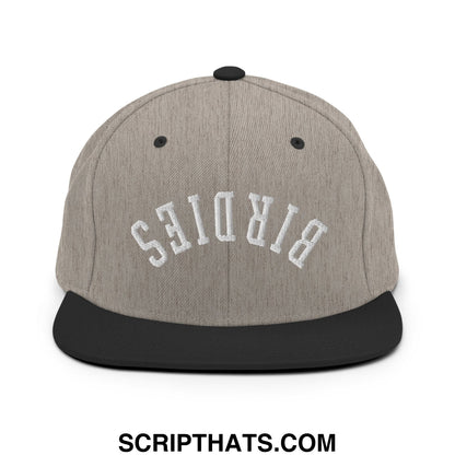 Gray and black snapback hat with white birds embroidered in arched lettering on a flat bill brim