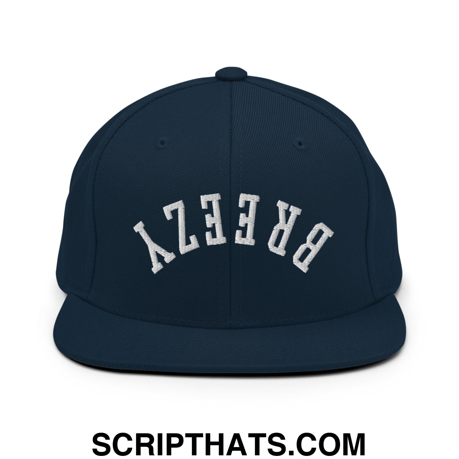Navy blue snapback cap with white arched breezy embroidery featuring a flat bill brim and adjustable back closure