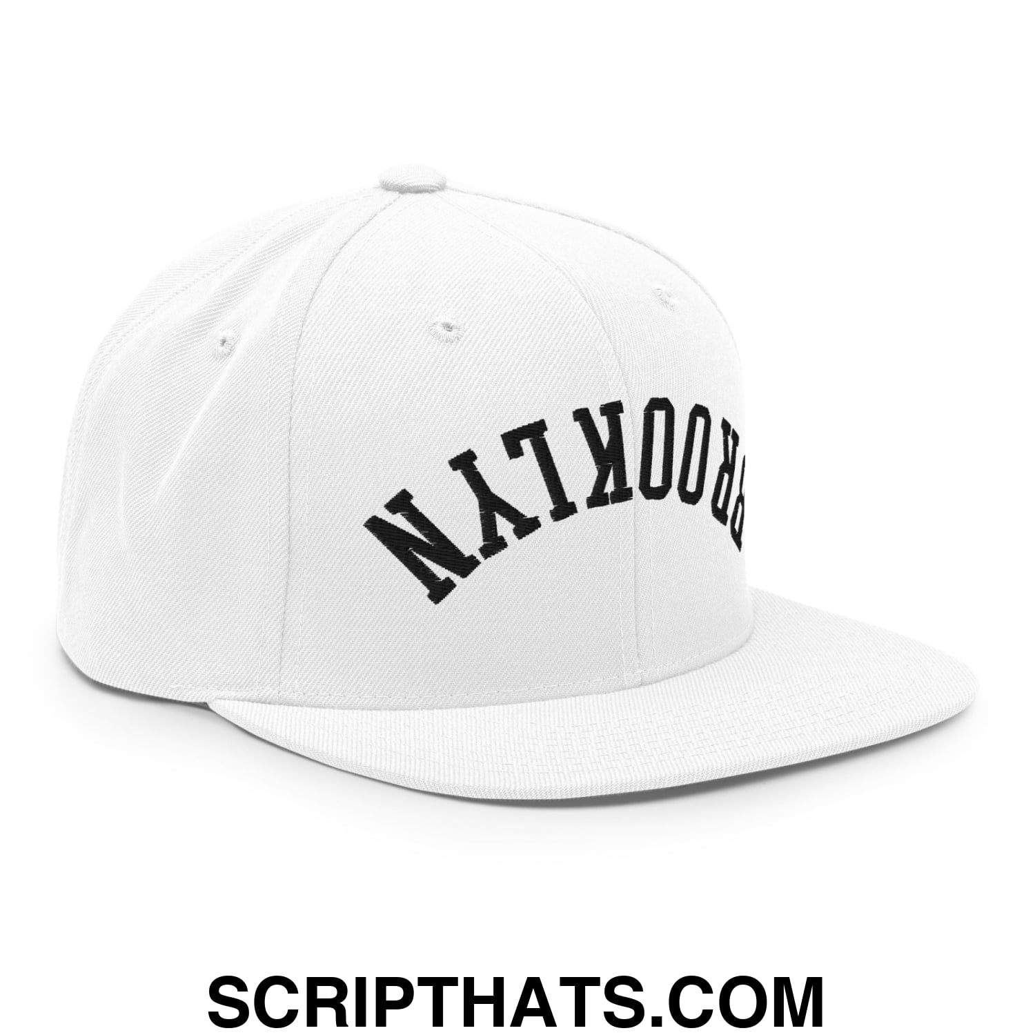 White snapback cap with black arched nyc brooklyn lettering and flat bill brim embroidered design