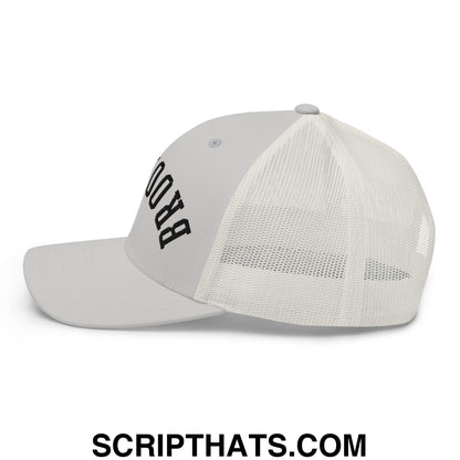 A light gray upside down Brooklyn embroidered mesh trucker hat with black lettering and mesh back