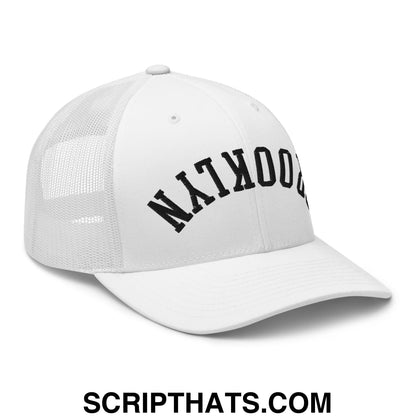 White mesh trucker hat with black arched brooklyn embroidery on front from upside down brooklyn collection