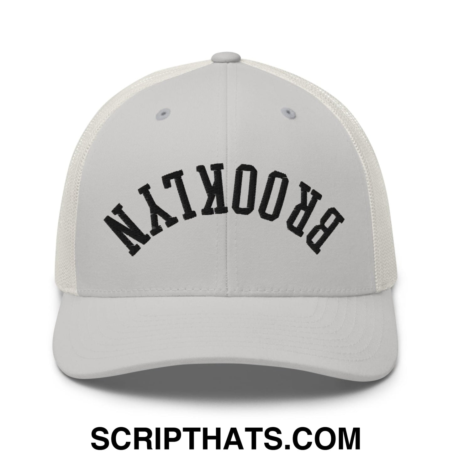 White mesh trucker hat with black arched brooklyn embroidery featuring upside down design