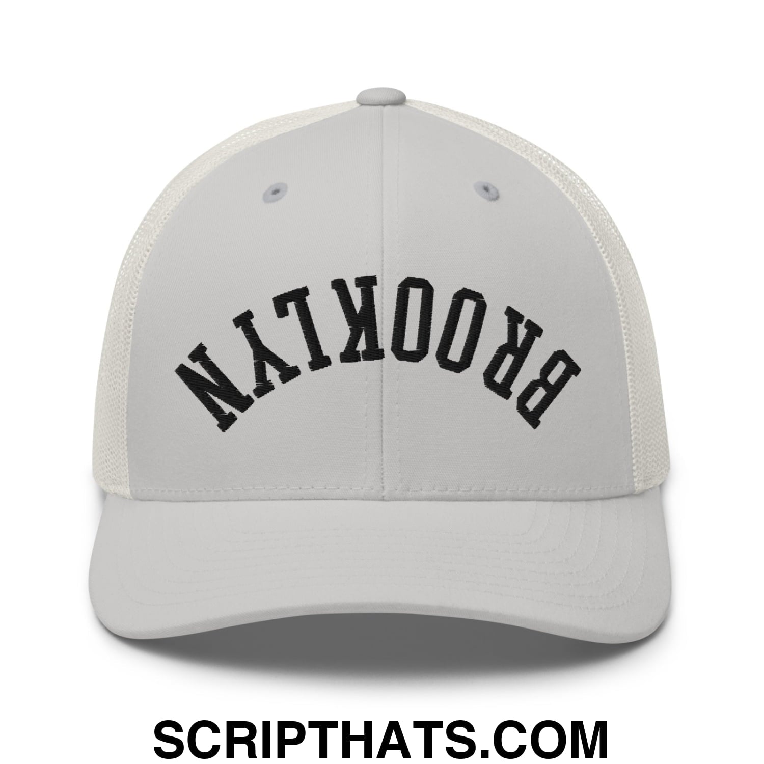 White mesh trucker hat with black arched brooklyn embroidery featuring upside down design