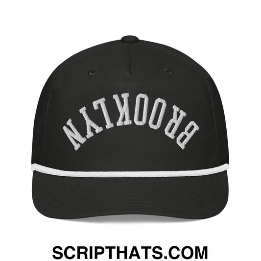 Black baseball cap with white embroidered brooklyn arch and contrasting white brim stripe in upside down rope hat style