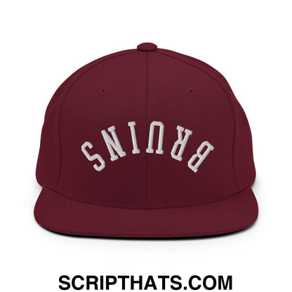 Maroon snapback cap with white arched brunis embroidery and flat bill brim in upside down bruins design
