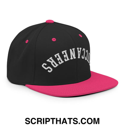 Black and pink snapback cap with upside down Buccaneers embroidered in white flat bill brim design