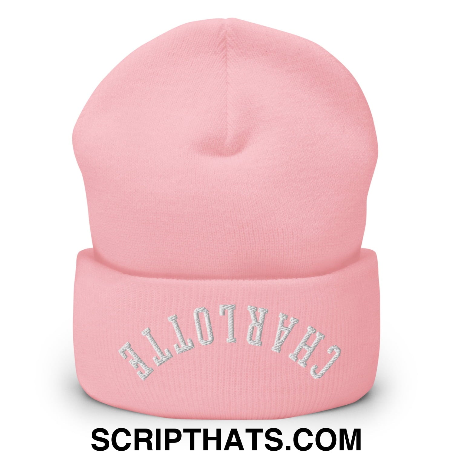 A soft pink knit cuffed beanie with upside down charlotte embroidered in silver thread on the brim