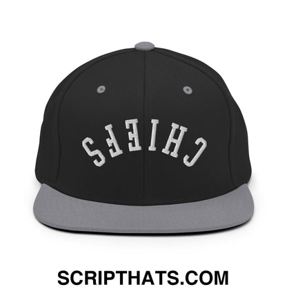 Black snapback cap with gray brim and button featuring white embroidered chiefs in arched lettering on front