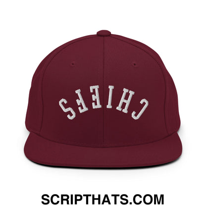 Maroon snapback cap with white embroidered chiefs lettering and flat bill brim in an upside down design