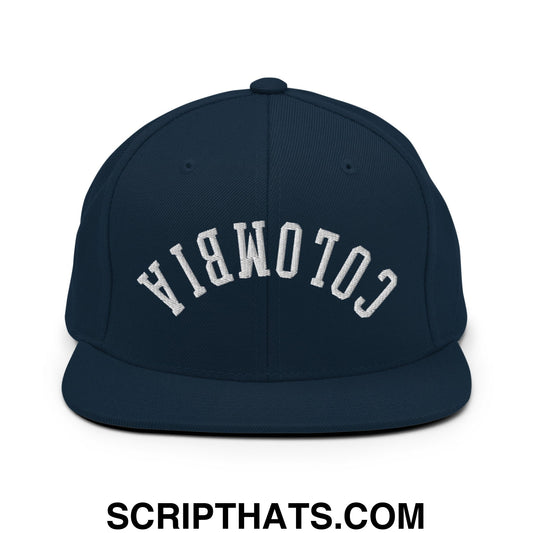 Navy blue snapback hat with white embroidered upside down colombia flat bill brim design