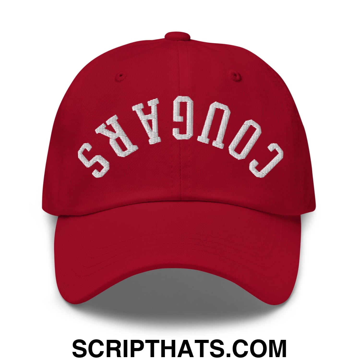 Red unstructured dad hat with white embroidered cougars lettering in an arched design