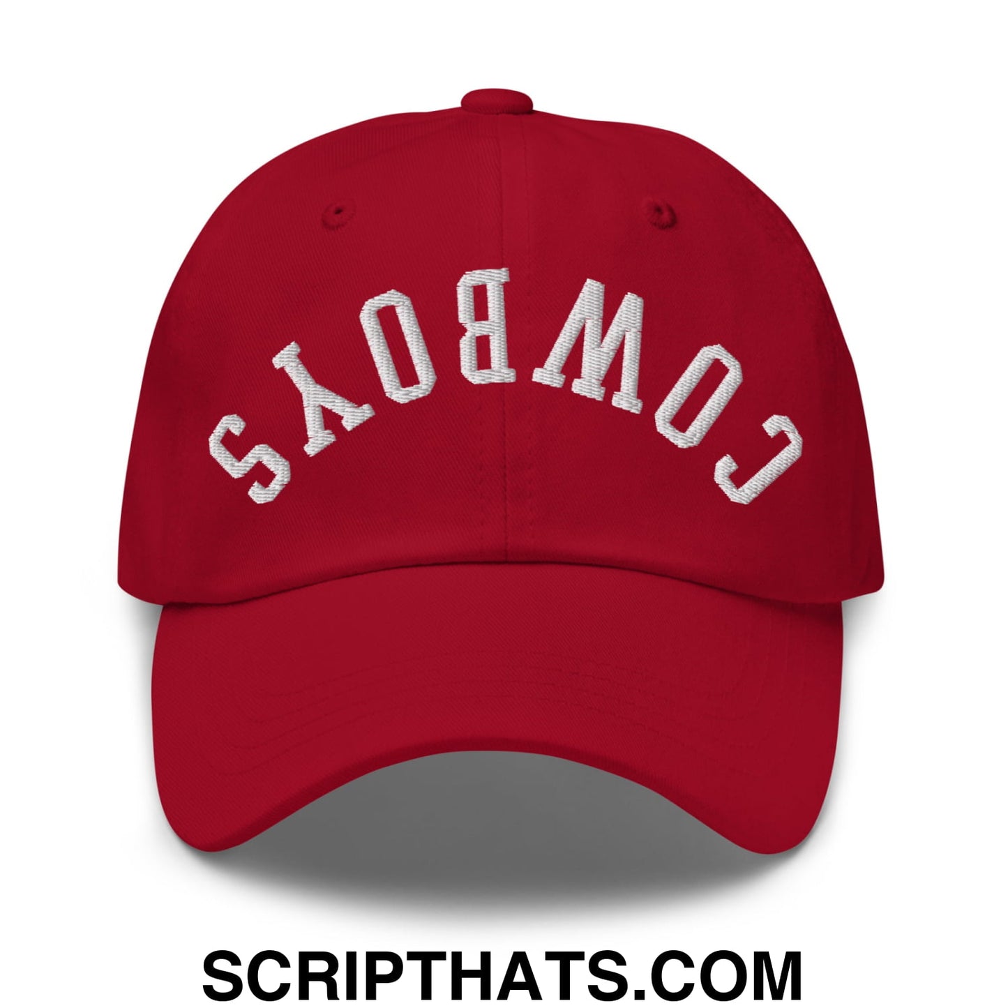 Red unstructured dad hat with white embroidered cowboys lettering upside down on the front