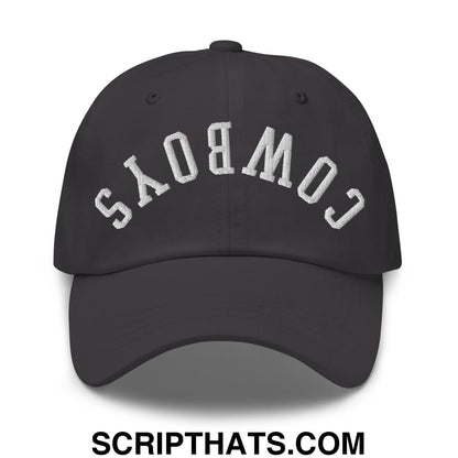 Black unstructured dad hat with white embroidered upside down cowboys lettering in an arched design