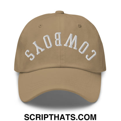 Tan unstructured dad hat with white embroidered cowboys lettering in an arched design Upside Down Cowboys model