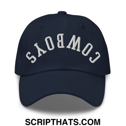 Navy blue unstructured dad hat with white embroidered upside down cowboys lettering in an arched design
