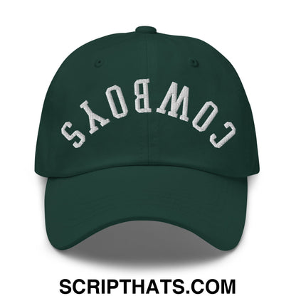 Dark green unstructured dad hat with white embroidered upside down cowboys lettering in an arched design